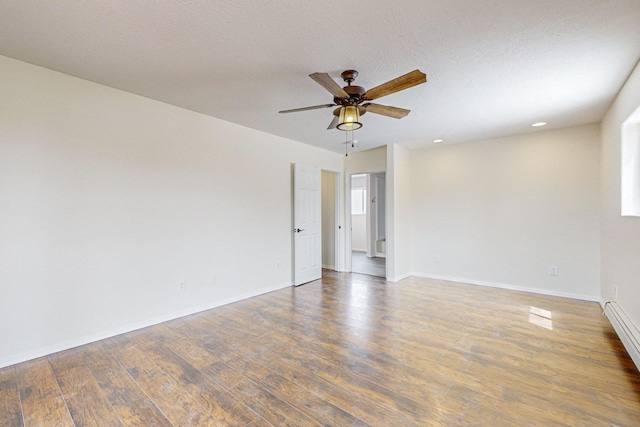 41 El Rancho Grande Rd, Mcintosh, NM 87032 - unfurnished room featuring wood finished floors, a ceiling fan, recessed lighting, and a baseboard heating unit