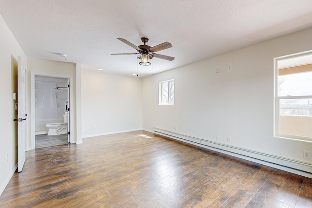 41 El Rancho Grande Rd, Mcintosh, NM 87032 - empty room featuring baseboard heating, a ceiling fan, wood finished floors, and a textured ceiling