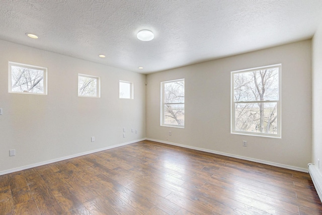 41 El Rancho Grande Rd, Mcintosh, NM 87032 - empty room with a textured ceiling, dark wood-style floors, and recessed lighting