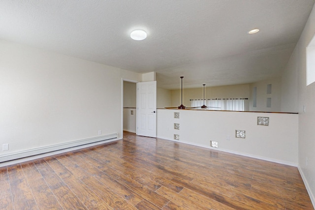41 El Rancho Grande Rd, Mcintosh, NM 87032 - empty room featuring a baseboard heating unit, wood finished floors, and recessed lighting
