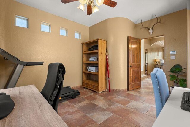 9845 Boulder St NW, Albuquerque, NM 87114 - office with ceiling fan, baseboards, light stone finish flooring, and arched walkways