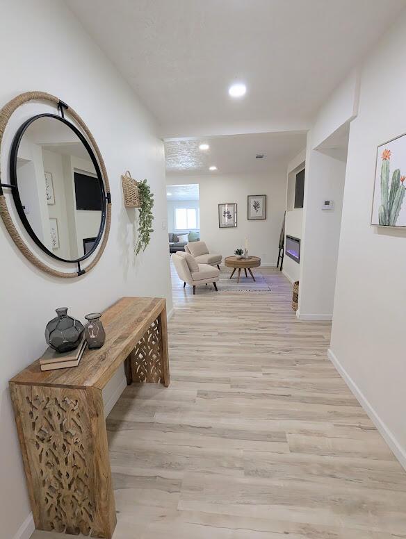 2824 Texas St NE, Albuquerque, NM 87110 - hall with light wood-style flooring, recessed lighting, and baseboards
