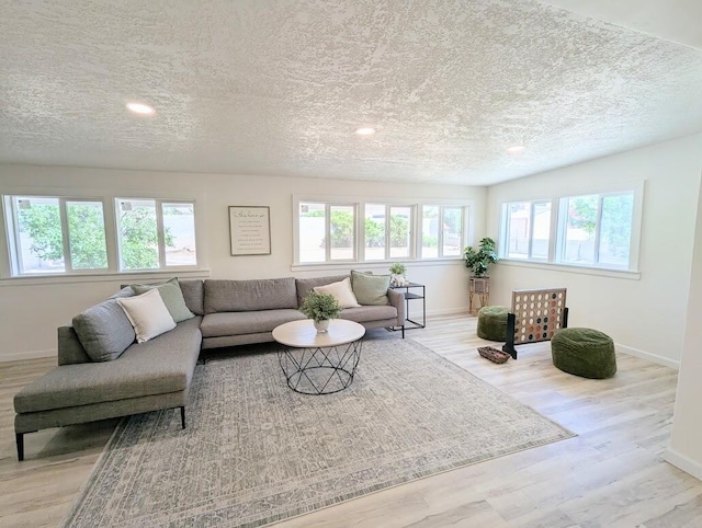 2824 Texas St NE, Albuquerque, NM 87110 - living room with a textured ceiling, baseboards, wood finished floors, and recessed lighting