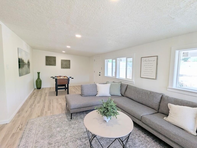 2824 Texas St NE, Albuquerque, NM 87110 - living area featuring a textured ceiling, light wood finished floors, recessed lighting, and baseboards