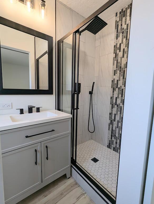 2824 Texas St NE, Albuquerque, NM 87110 - bathroom featuring a stall shower and vanity