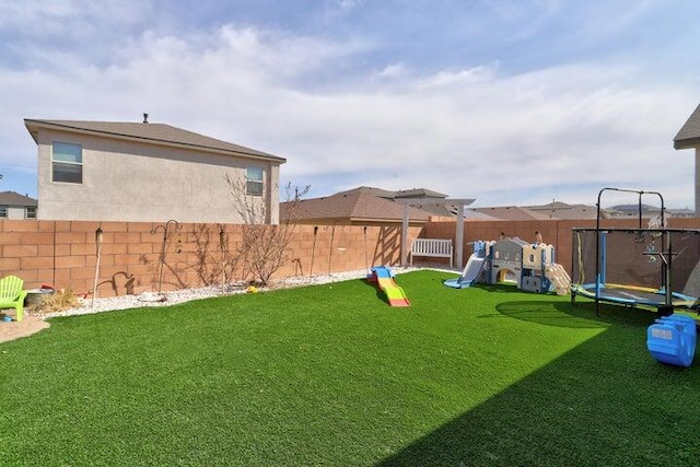 4871 Longs Peak Rd NE, Rio Rancho, NM 87144 - view of yard featuring a trampoline and a playground