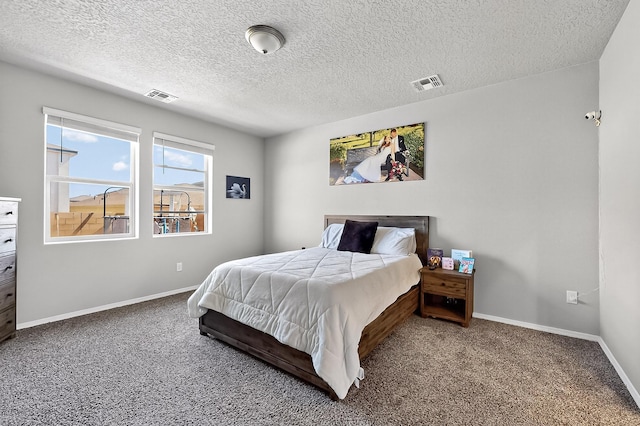 4871 Longs Peak Rd NE, Rio Rancho, NM 87144 - carpeted bedroom featuring baseboards and a textured ceiling