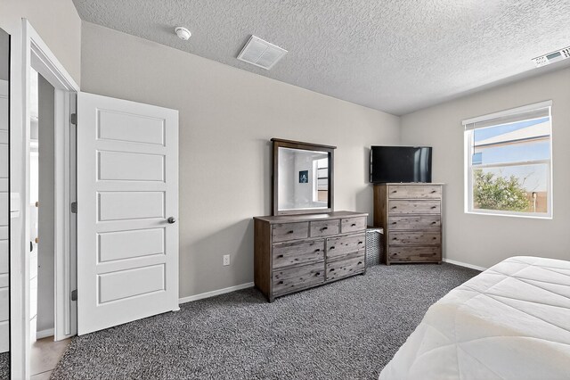 4871 Longs Peak Rd NE, Rio Rancho, NM 87144 - carpeted bedroom featuring a textured ceiling and baseboards
