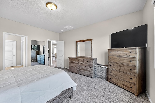 4871 Longs Peak Rd NE, Rio Rancho, NM 87144 - bedroom with carpet flooring, a textured ceiling, and baseboards
