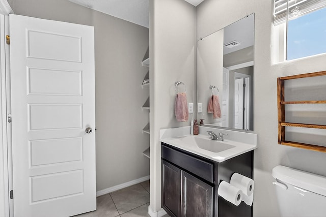 4871 Longs Peak Rd NE, Rio Rancho, NM 87144 - bathroom featuring vanity, toilet, and tile patterned flooring
