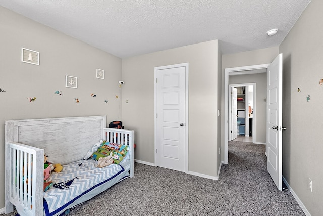 4871 Longs Peak Rd NE, Rio Rancho, NM 87144 - carpeted bedroom with baseboards and a textured ceiling