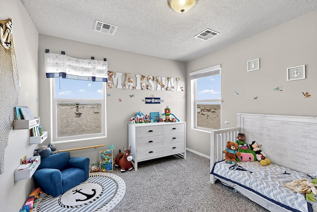 4871 Longs Peak Rd NE, Rio Rancho, NM 87144 - carpeted bedroom with a textured ceiling and baseboards