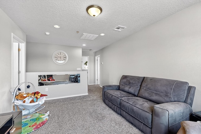 4871 Longs Peak Rd NE, Rio Rancho, NM 87144 - living room featuring carpet flooring, recessed lighting, a textured ceiling, and baseboards