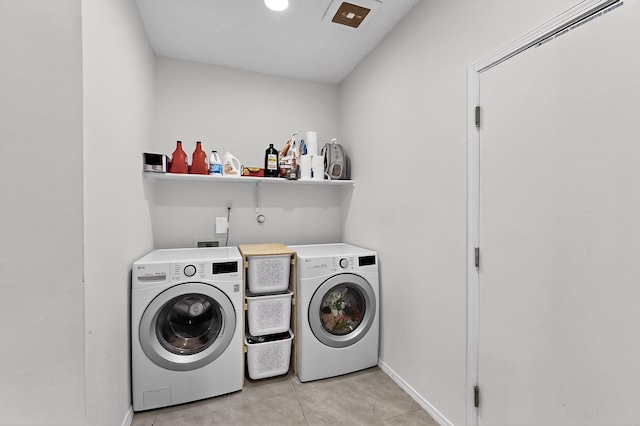 4871 Longs Peak Rd NE, Rio Rancho, NM 87144 - washroom with washer and clothes dryer, light tile patterned floors, and baseboards