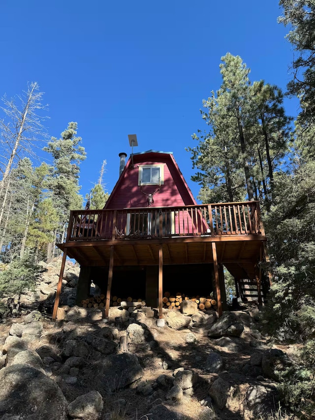 123 Pine Dr, Jemez Springs, NM 87025 - back of property with a deck, stairway, and a gambrel roof