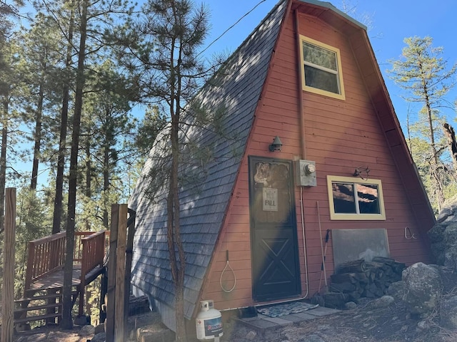 123 Pine Dr, Jemez Springs, NM 87025 - view of home's exterior with a gambrel roof