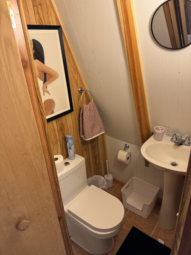123 Pine Dr, Jemez Springs, NM 87025 - half bath featuring wood walls, toilet, and tile patterned flooring