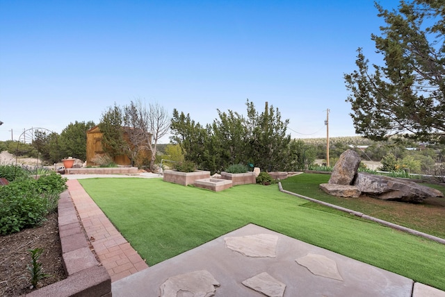 98 Edgewood Unit 7, Edgewood, NM 87015 - view of grassy yard with a storage shed and a patio area