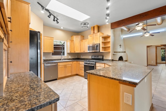 98 Edgewood Unit 7, Edgewood, NM 87015 - kitchen with stainless steel appliances, light brown cabinets, a peninsula, track lighting, and light tile patterned floors