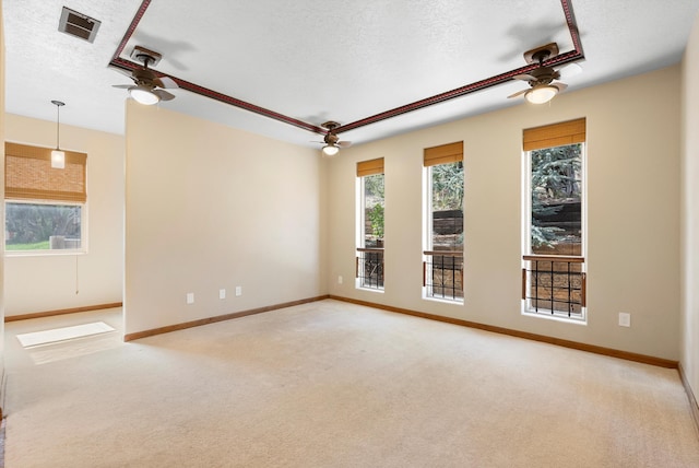 98 Edgewood Unit 7, Edgewood, NM 87015 - unfurnished room with a ceiling fan, a textured ceiling, and carpet