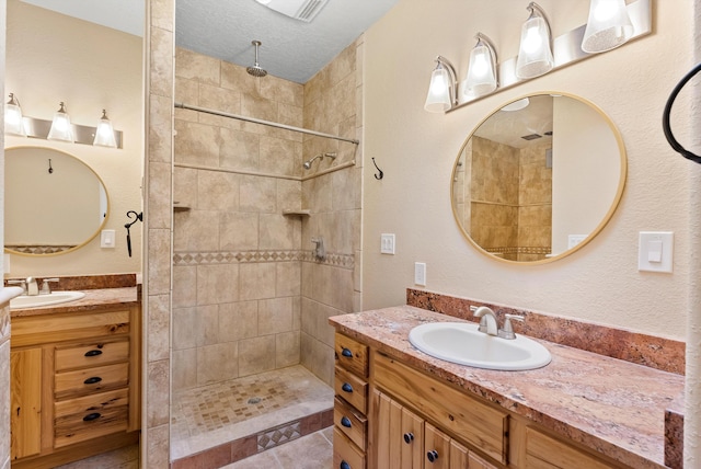 98 Edgewood Unit 7, Edgewood, NM 87015 - full bath featuring two vanities, tiled shower, and tile patterned flooring