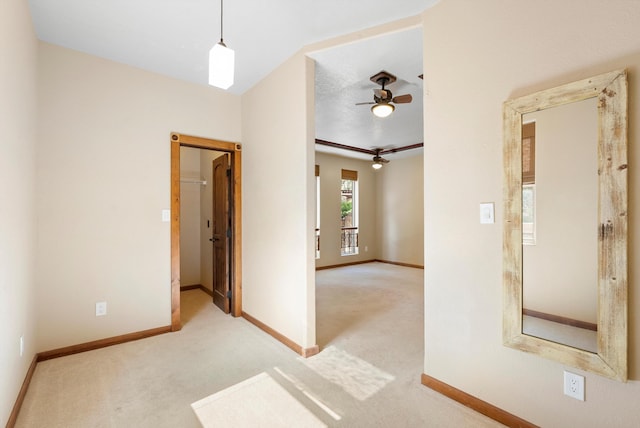 98 Edgewood Unit 7, Edgewood, NM 87015 - spare room featuring light carpet and a ceiling fan