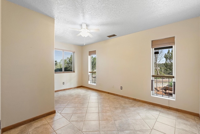98 Edgewood Unit 7, Edgewood, NM 87015 - spare room featuring ceiling fan, a textured ceiling, and light tile patterned flooring