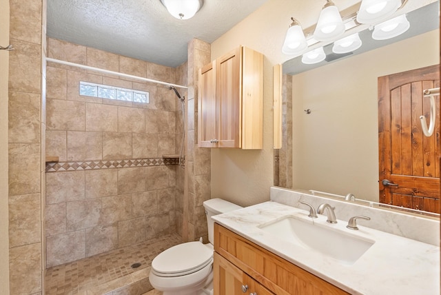98 Edgewood Unit 7, Edgewood, NM 87015 - full bathroom featuring vanity, tiled shower, and a textured ceiling