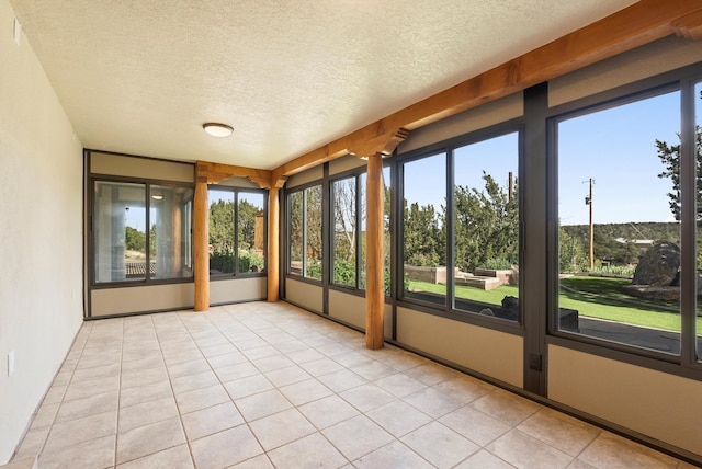 98 Edgewood Unit 7, Edgewood, NM 87015 - unfurnished sunroom featuring a textured ceiling and tile patterned floors