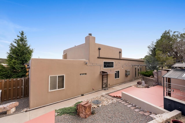 98 Edgewood Unit 7, Edgewood, NM 87015 - back of property with a patio, stucco siding, and a chimney