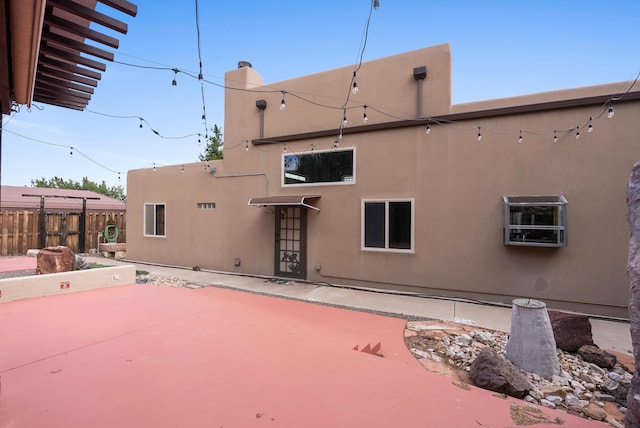 98 Edgewood Unit 7, Edgewood, NM 87015 - rear view of property featuring stucco siding and a patio