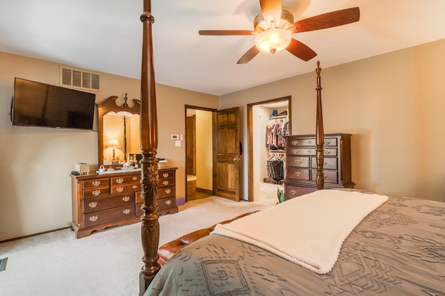 4706 Glenwood Hills Dr NE, Albuquerque, NM 87111 - bedroom with light carpet, a spacious closet, a closet, and ceiling fan