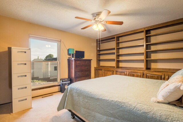 4706 Glenwood Hills Dr NE, Albuquerque, NM 87111 - bedroom with light carpet, a textured ceiling, and ceiling fan