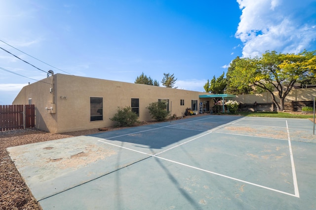 4706 Glenwood Hills Dr NE, Albuquerque, NM 87111 - rear view of property with stucco siding and uncovered parking