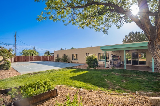 4706 Glenwood Hills Dr NE, Albuquerque, NM 87111 - view of yard featuring a ceiling fan, a patio, and a garden