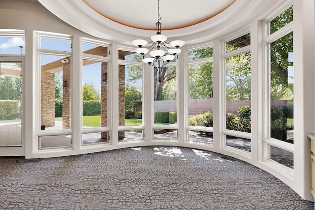2600 Griegos Pl NW, Albuquerque, NM 87107 - unfurnished sunroom featuring carpet and a chandelier