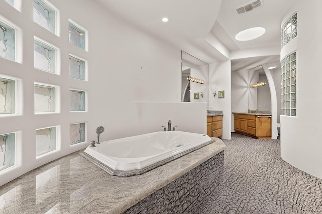 2600 Griegos Pl NW, Albuquerque, NM 87107 - full bathroom featuring vanity, a bath, and recessed lighting