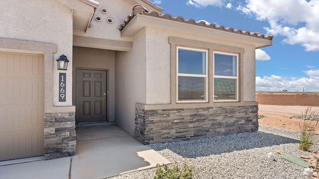 1660 Maggie Dr, Rio Rancho, NM 87144 - entrance to property with stone siding and stucco siding