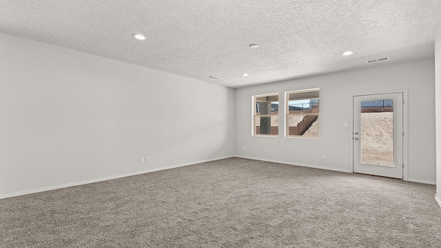 1660 Maggie Dr, Rio Rancho, NM 87144 - unfurnished room with carpet floors, a textured ceiling, recessed lighting, and baseboards