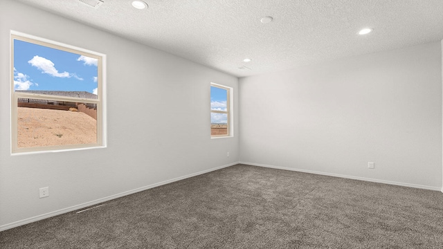 1660 Maggie Dr, Rio Rancho, NM 87144 - spare room featuring carpet floors, a textured ceiling, recessed lighting, and baseboards