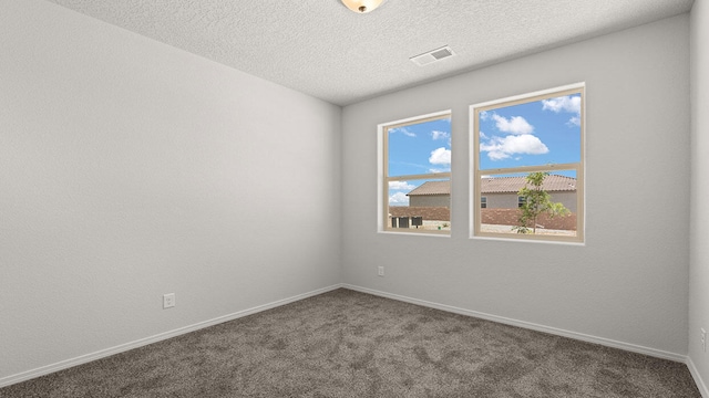 1660 Maggie Dr, Rio Rancho, NM 87144 - carpeted spare room featuring baseboards and a textured ceiling