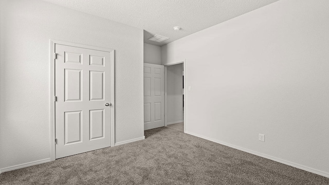 1660 Maggie Dr, Rio Rancho, NM 87144 - unfurnished bedroom featuring carpet, a textured ceiling, and baseboards
