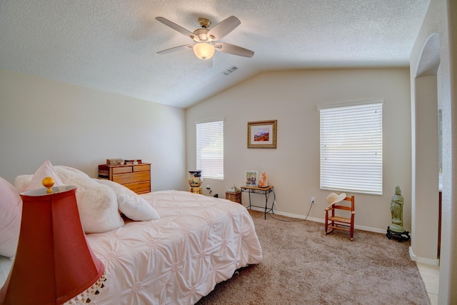 7217 Skagway Dr NE, Rio Rancho, NM 87144 - bedroom with vaulted ceiling, carpet floors, a textured ceiling, baseboards, and a ceiling fan