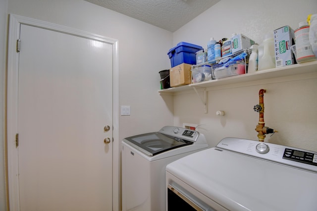 7217 Skagway Dr NE, Rio Rancho, NM 87144 - laundry room featuring washer and clothes dryer and a textured ceiling