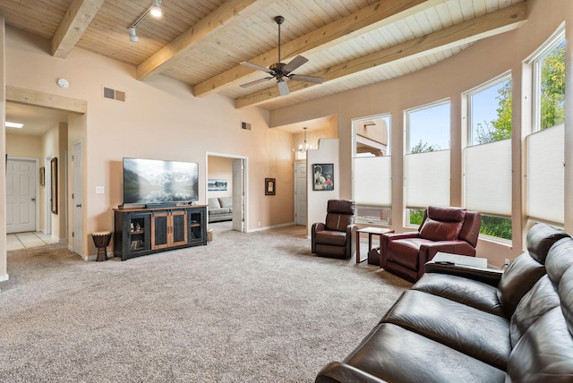 3424 Calle Suenos SE, Rio Rancho, NM 87124 - carpeted living room featuring a wooden ceiling with exposed beams, a ceiling fan, and track lighting