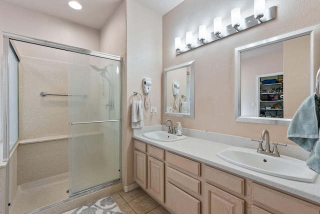 3424 Calle Suenos SE, Rio Rancho, NM 87124 - bathroom with a shower stall, double vanity, and tile patterned flooring