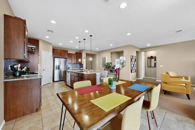 2927 Kings Canyon Loop NE, Rio Rancho, NM 87144 - dining space with light tile patterned floors, recessed lighting, and baseboards