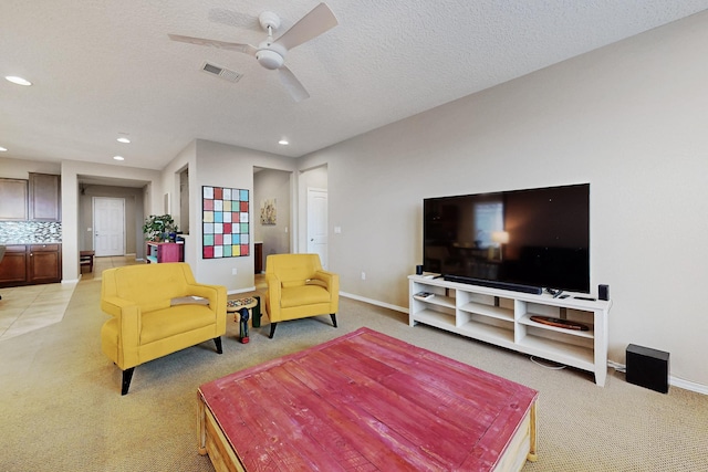 2927 Kings Canyon Loop NE, Rio Rancho, NM 87144 - living area with light carpet, recessed lighting, ceiling fan, baseboards, and a textured ceiling