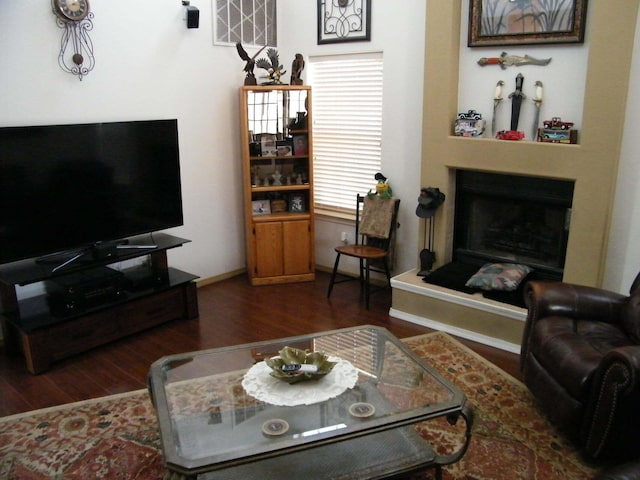 4608 Stafford Pl NW, Albuquerque, NM 87120 - living area featuring wood finished floors, a fireplace with raised hearth, and baseboards