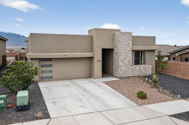6854 Cleary Loop NE, Rio Rancho, NM 87144 - southwest-style home featuring driveway, an attached garage, stucco siding, and a mountain view